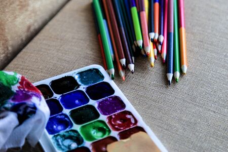 Colored watercolor pencils and watercolor paints. Creativity and drawingの写真素材