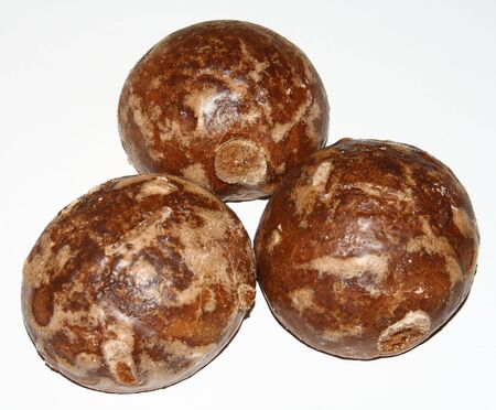 3 gingerbreads from dark a flour on a white backgroundの写真素材