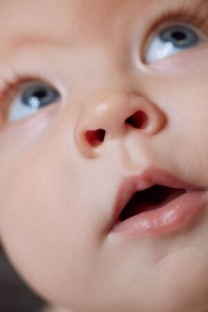 Close-up portrait of a beautiful cute adorable babyの写真素材