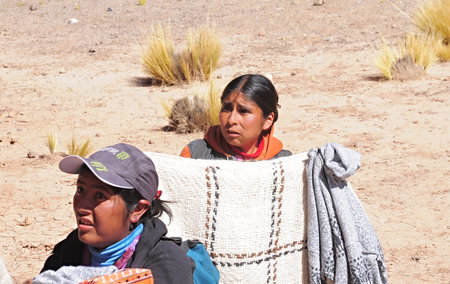 Women-indians sell clothes and souvenirs during the train stop in Andes on April 27, 2013, Argentina  Altitude approx  is 4000 m above sea level のeditorial素材
