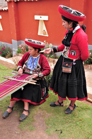 Women show process of production of the clothes from alpaca and llama wool on May 17, 2013 in Chinchero, Peru  Chinchero-settlement locates 58 km away from Cusco のeditorial素材