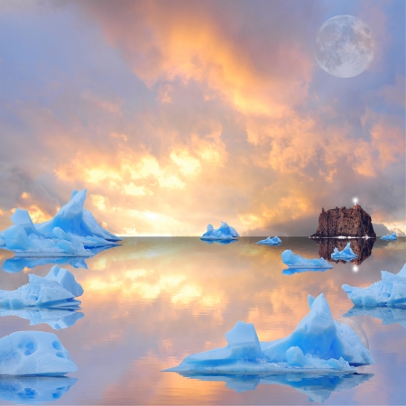 Icebergs floating in the sea at sunset  の写真素材