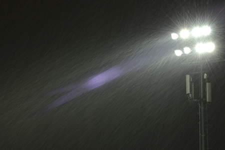 Image of the stadium spotlights under the snow.の写真素材