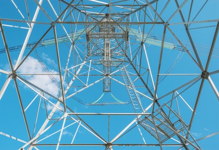 High-voltage tower on the blue sky background.の写真素材