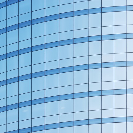 Office building wall in the business city center at sunset time.