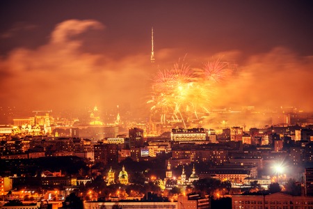 Fireworks above the city at evening time.の写真素材