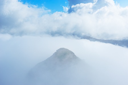 Fantastic cloudscape above the mountains at autumn day time.の写真素材
