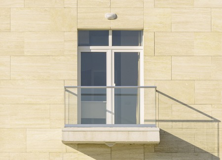 Doors and balcony of the new townhouse at sunset time.の写真素材