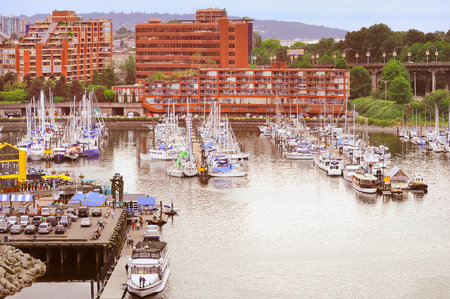 Boats and yachts by Granville island public market at evening time. Vancouver. Canada.のeditorial素材
