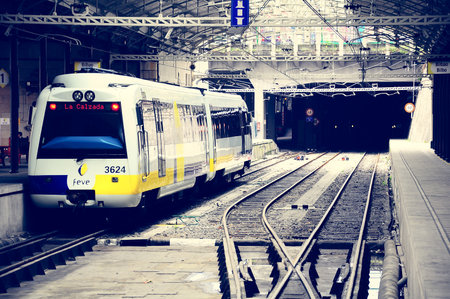Bilbao, Spain - June 10, 2010: Passenger diesel train of Feve railway company stands at the underground station. Feve railway connects Hendaye (France) and Ferrol (northwest Spain).のeditorial素材