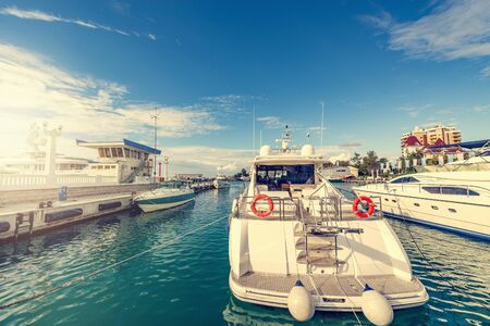 Many yachts in the port at sunset time.の写真素材
