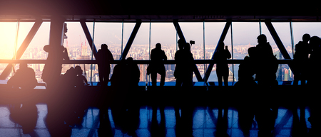 People on the tower viewpoint at sunset time.の写真素材