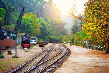 Local people wait for the train on the platform to Bagou at early morning time. Mifenguan. Jiayang...