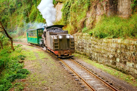 Steam narrow-gauge train moves from Bagou to Yuejin through the chinese countryside. Jiayang Mining Region. Sichuan province. China.の写真素材