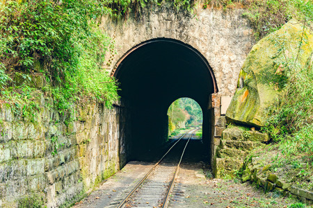Tunnel and steam narrow-gauge railway from Yuejin to Bagou in the jungle. Jiayang Mining Region. Sichuan province. Chinaの写真素材