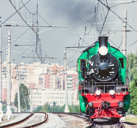 Steam train moves at hot day time.の写真素材