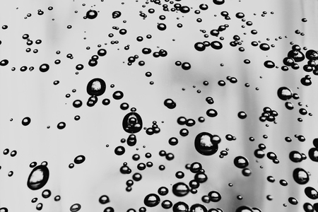 Bubbles in the water on colorful background.の写真素材