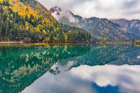 Autumn view of the lake with pure water at early morning time. Jiuzhaigou nature reserve (Jiuzhai Valley National Park), China.の写真素材