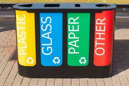 Multicolored bin for separate waste collection on the railway station platform.の写真素材