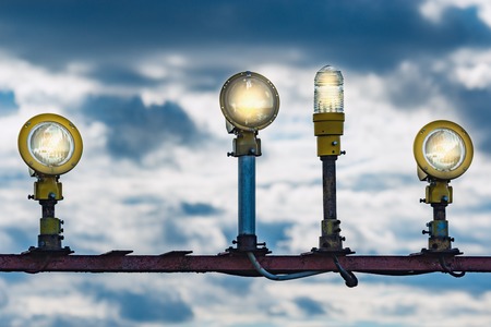 Lights of the glide path on evening sky background.の写真素材