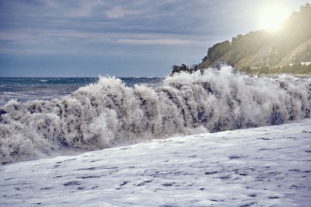 Sea coast at the stormy sunset time.の写真素材