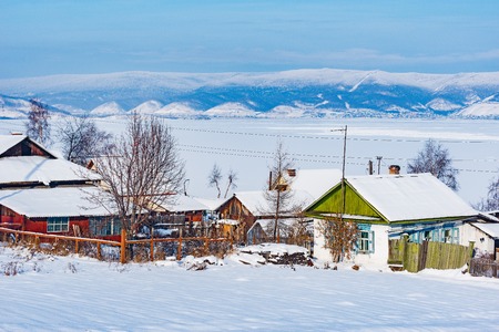 Winter morning view of the village houses by Baikal lake. Sludanka. Russia.の写真素材