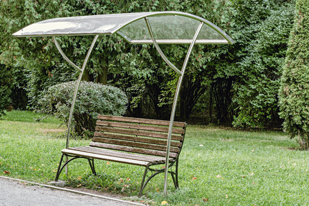 Wooden retro bench in the city park.の写真素材