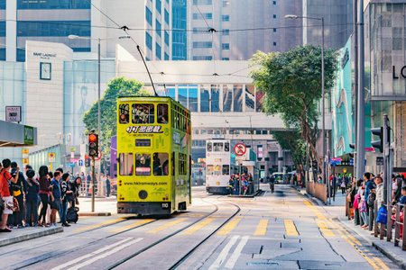 Central District, Hong Kong - December 10, 2016: Retro tramways and people on the city streets.のeditorial素材
