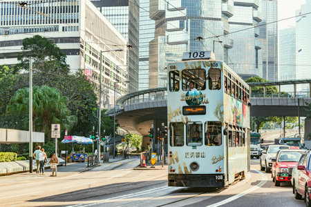 Central District, Hong Kong - December 10, 2016: Retro tramways and people on the city streets.のeditorial素材