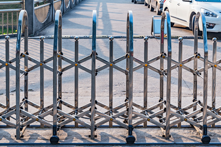 Metal fence by the stadium entrance at day time.の写真素材