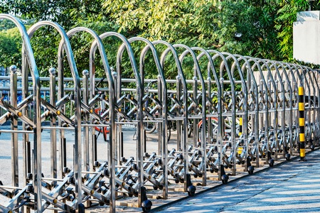Metal fence by the stadium entrance at day time.の写真素材