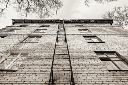 Exterior view of the building with the old fire escape.の写真素材