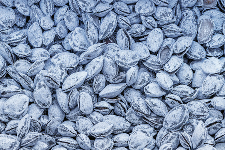 Apricot pits in the box inside of the shop.の写真素材