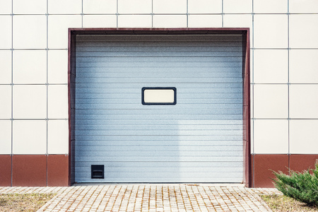 Metal gray gates of the private garage