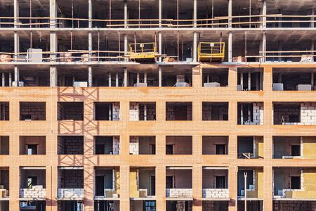 Exterior of new building on the construction site.の写真素材