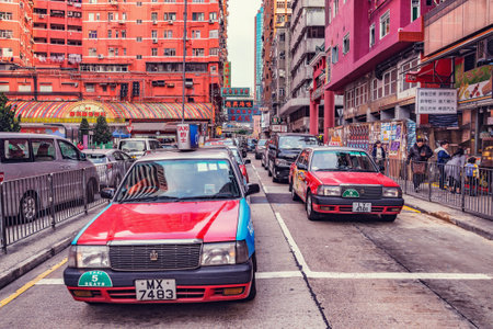 Hong Kong - December 15, 2016: Taxi cars on the central city street.のeditorial素材