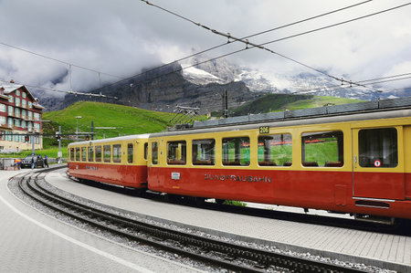 Kleine Scheidegg, Switzerland - July 09, 2012: Train to Kleine Scheidegg arrives from Jungfraujoch station.のeditorial素材
