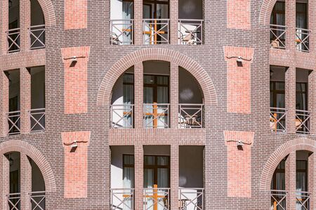 Windows and balconies of the new building at day time.の写真素材