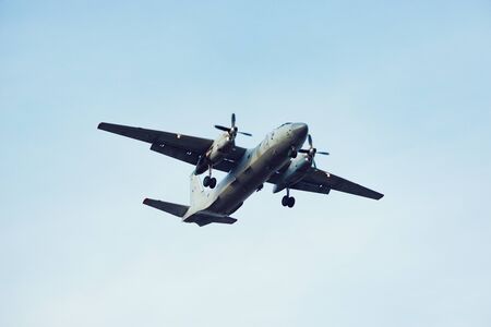 Freight military plane in the clear sky at evening time.の写真素材
