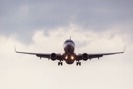 Landing of the passenger plane at evening time.