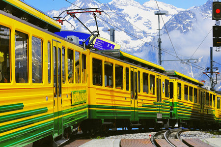 Kleine Scheidegg, Switzerland - June 11, 2010: Cogwheel train to Grindelwald departs from the platform.のeditorial素材