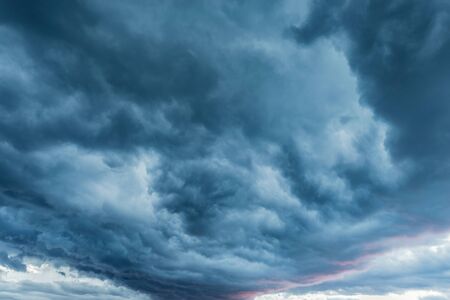Amazing cloudscape on the sky at sunset time after rain.