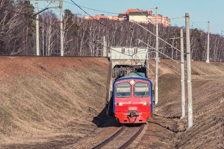 Passenger train moves through the tunnel. Russia.
