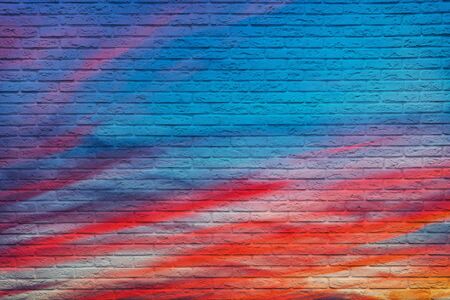Clouds on the sunset sky drawn on the brick wall.