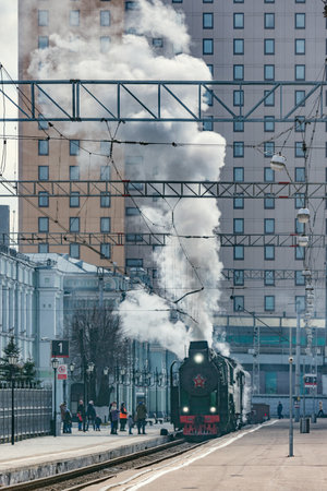 Moscow, Russia - April 07, 2019: Steam train departs from Riga railway station.のeditorial素材