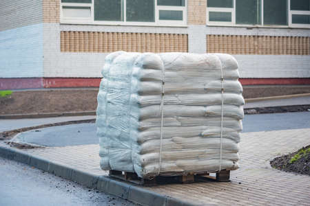 Big bags with soil on the pallet by the construction site.の写真素材