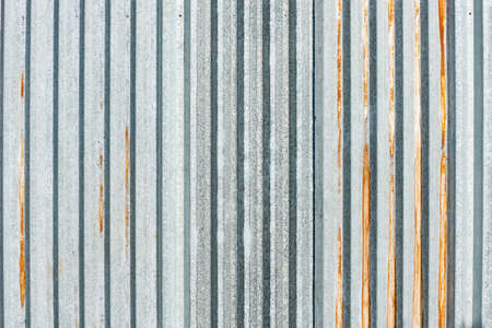 Old gray metallic vertical material wall background.の写真素材