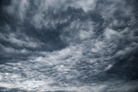 Dark storm clouds before the rain at day time.の写真素材