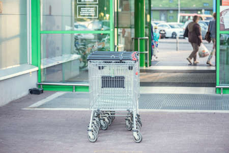 Shopping carts by the entrance of the supermarket.の写真素材
