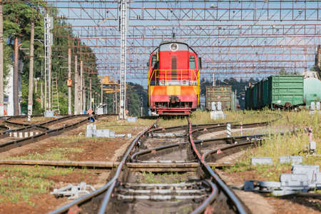 Freight trains stand on the station at evening time.の写真素材